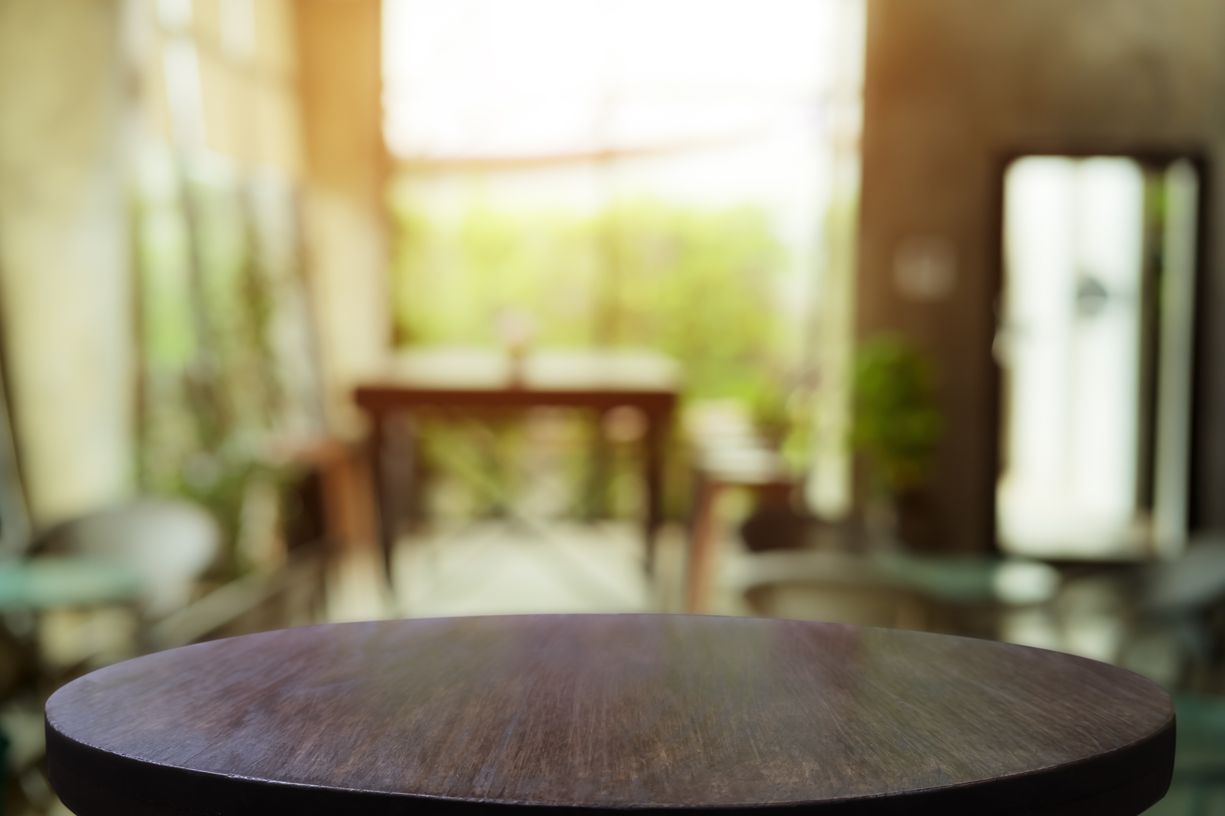 Empty Wooden Table with Restaurant Cafe Background